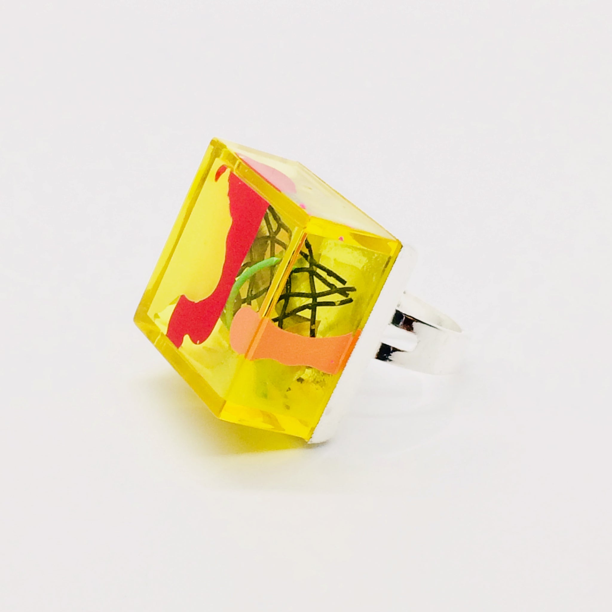 Yellow Fluorescent lightweight Plexiglas adjustable ring with red and white acrylic paint and wire mesh, hand assembled and painted for the Nodes Collection by Olga Alexander